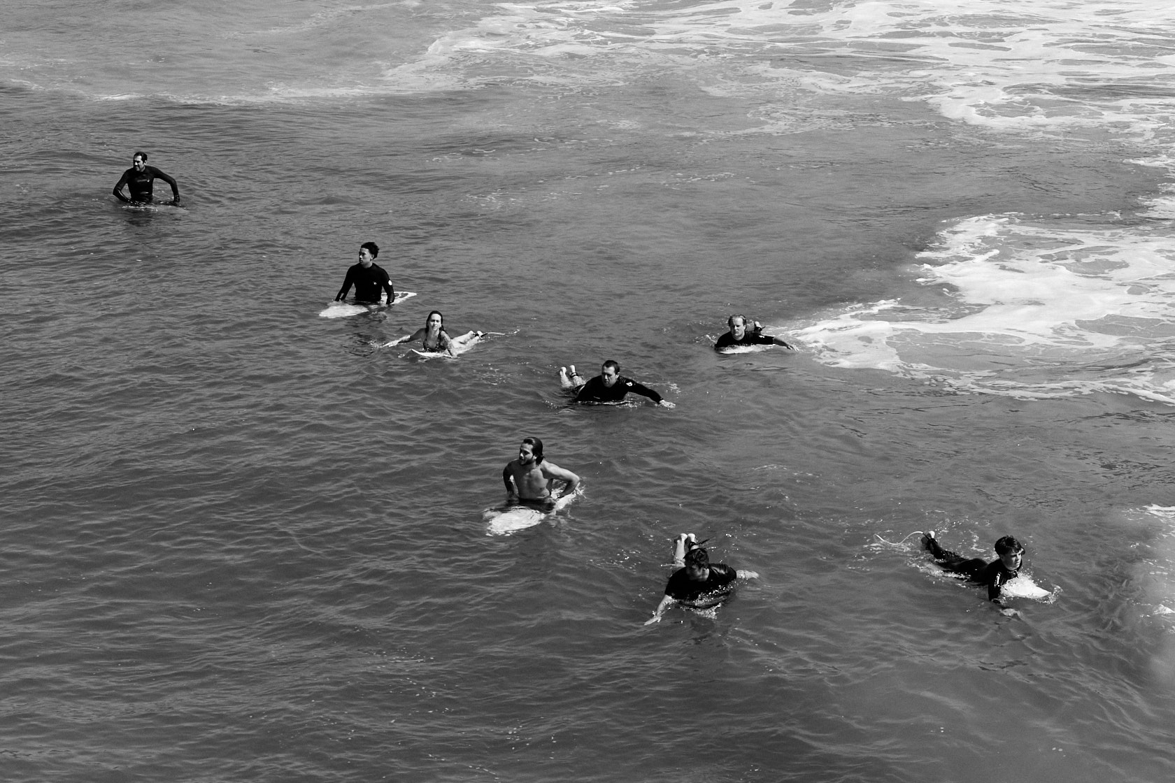 Pod of surfers, lining up